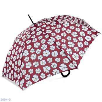 Ombrello aperto con un design a fiori color crema su sfondo bordeaux.